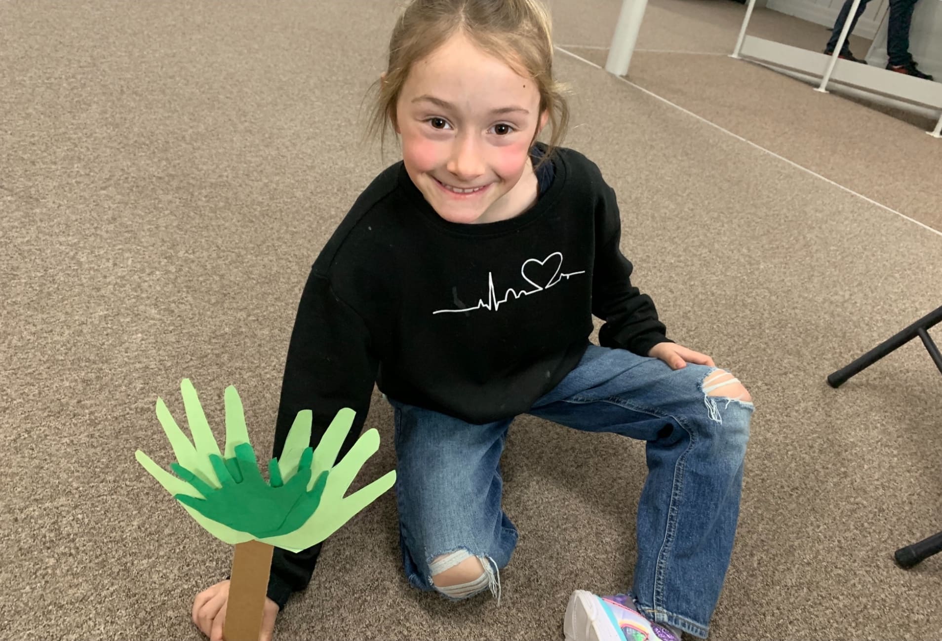 small girl with paper hands